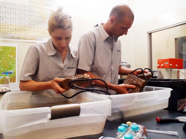 Drs. Shimrit Perkol-Finkel (left) and Ido Sella (right) examining a test batch of ECOncrete.  To evaluate the impact of design changes, the team runs experiments on small chunks of concrete.  Image from http://www.econcretetech.com/technology/research-and-development.