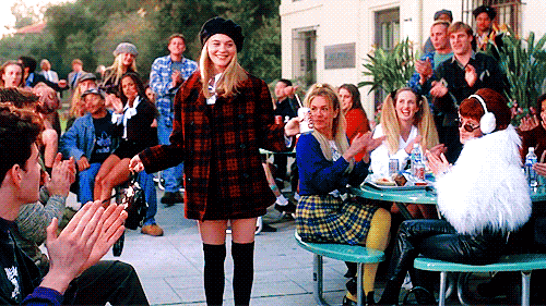 Your presentation (not outfit) should garner this kind of applause, but if Cher Horowitz taught us anything, it's that fashion can add some panache. GIF from http://gph.is/1Je6DTs