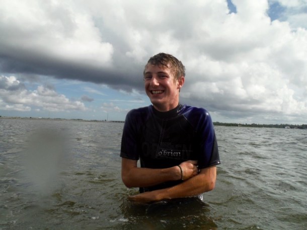 Patrick Winner keeping a smile on his face as he battles the freezing cold water to collect his oysters! PC: Abbey Vinson